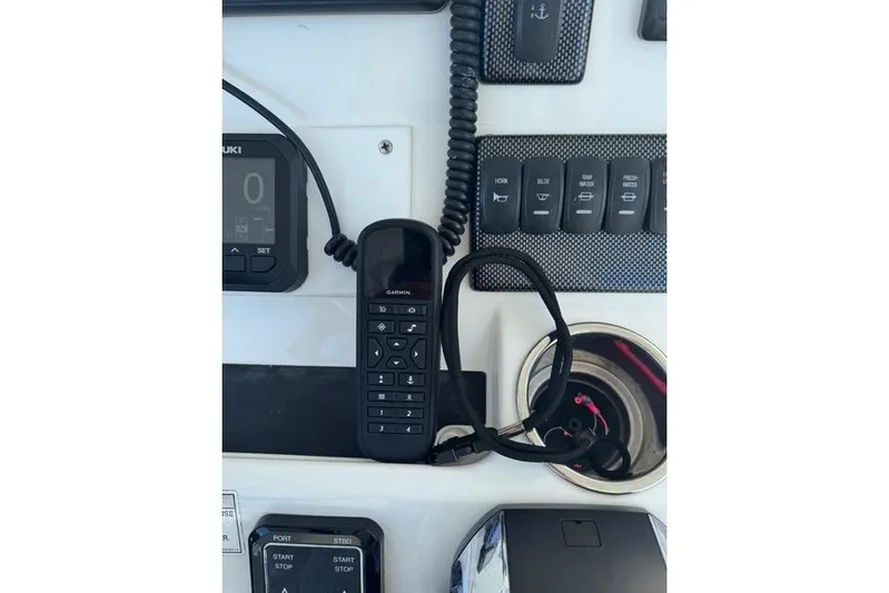  Yacht Photos Pics Control panel of a 2017 Regulator 25 boat with Garmin device and switches.