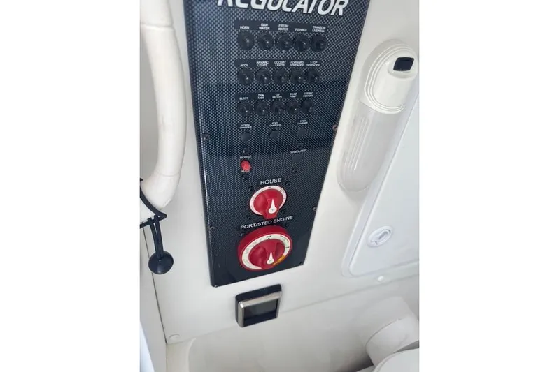  Yacht Photos Pics Control panel of a 2017 Regulator 25 boat with switches and dials.