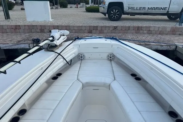  Yacht Photos Pics 2017 Regulator 25 boat with spacious seating, docked near Miller Marine truck.