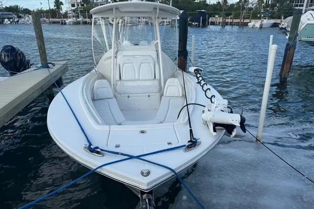  Yacht Photos Pics 2017 Regulator 25 boat docked in marina, featuring sleek design and spacious seating.