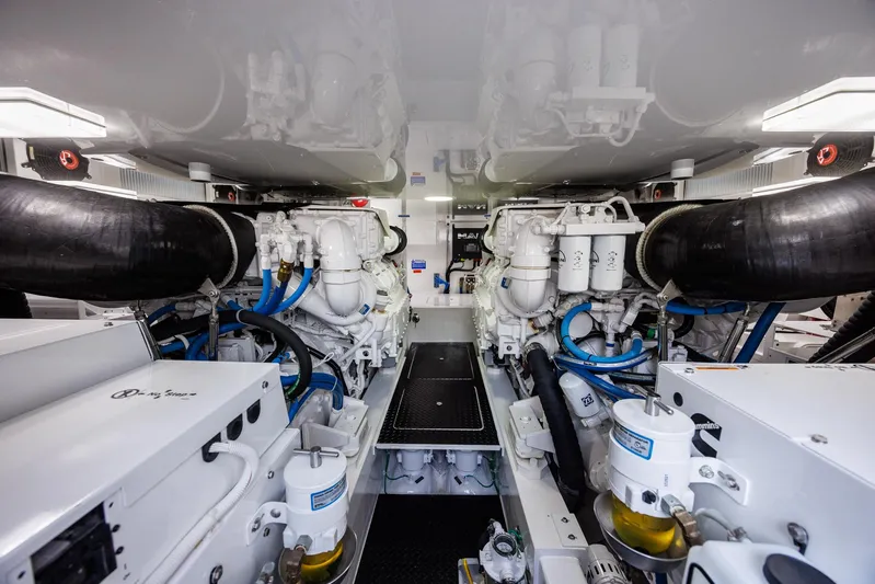 Insomnio Yacht Photos Pics Engine room of 2022 Viking 48 Convertible yacht, showcasing dual engines and advanced machinery.