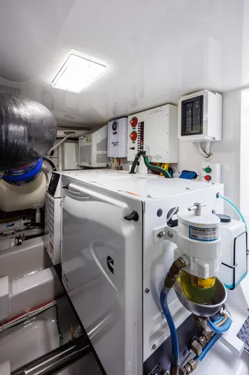Insomnio Yacht Photos Pics Engine room of 2022 Viking 48 Convertible yacht, showcasing modern equipment and systems.