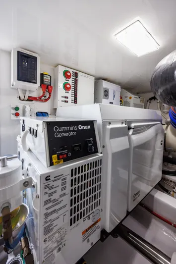 Insomnio Yacht Photos Pics Engine room of 2022 Viking 48 Convertible with Cummins Onan generator.