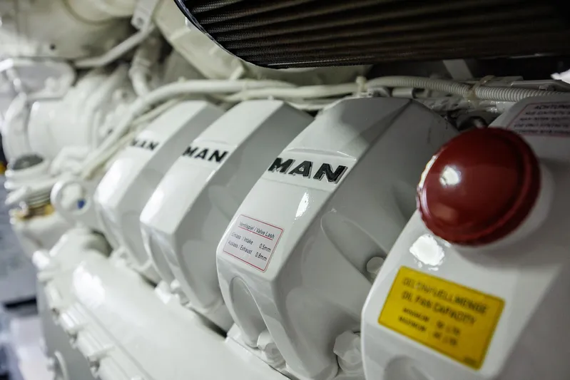 Insomnio Yacht Photos Pics Engine room of 2022 Viking 48 Convertible yacht featuring MAN engine components.