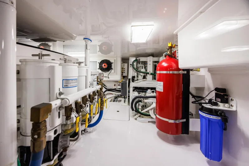 Insomnio Yacht Photos Pics Engine room of 2022 Viking 48 Convertible yacht, featuring advanced equipment and fire safety system.