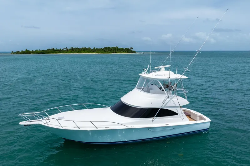 Insomnio Yacht Photos Pics 2022 Viking 48 Convertible yacht cruising near a tropical island.