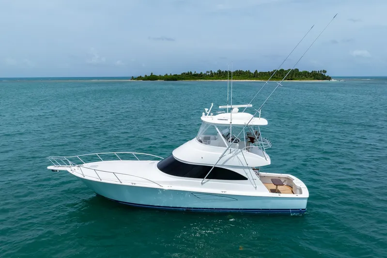 Insomnio Yacht Photos Pics 2022 Viking 48 Convertible yacht cruising near tropical island.