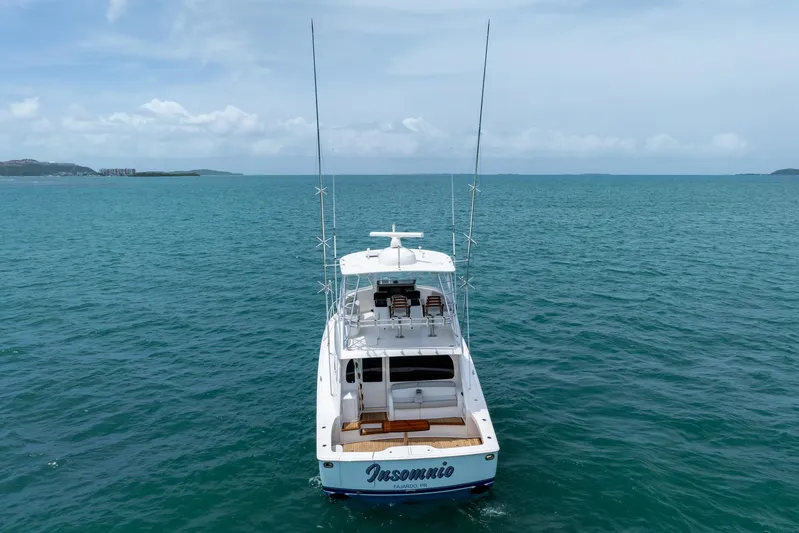Insomnio Yacht Photos Pics 2022 Viking 48 Convertible yacht on open sea, rear view.