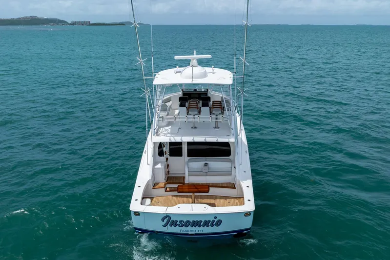 Insomnio Yacht Photos Pics 2022 Viking 48 Convertible yacht on open sea, rear view.