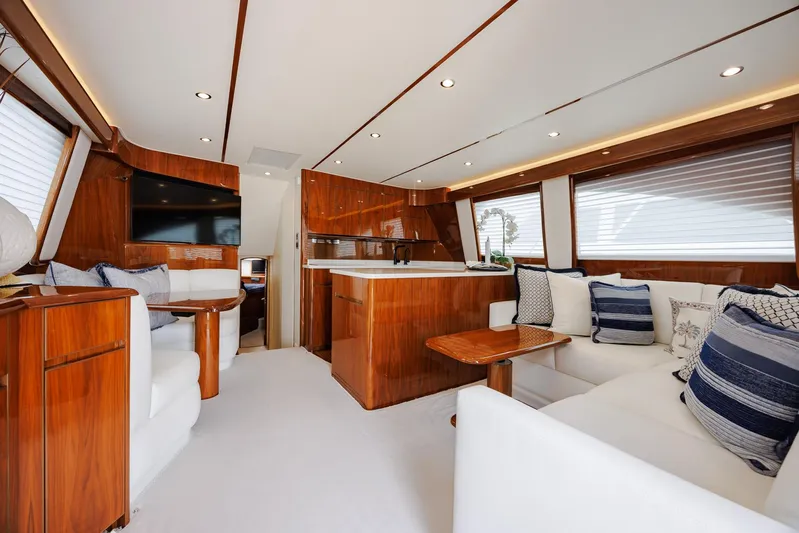 Insomnio Yacht Photos Pics Luxurious interior of 2022 Viking 48 Convertible yacht with elegant wood finishes.