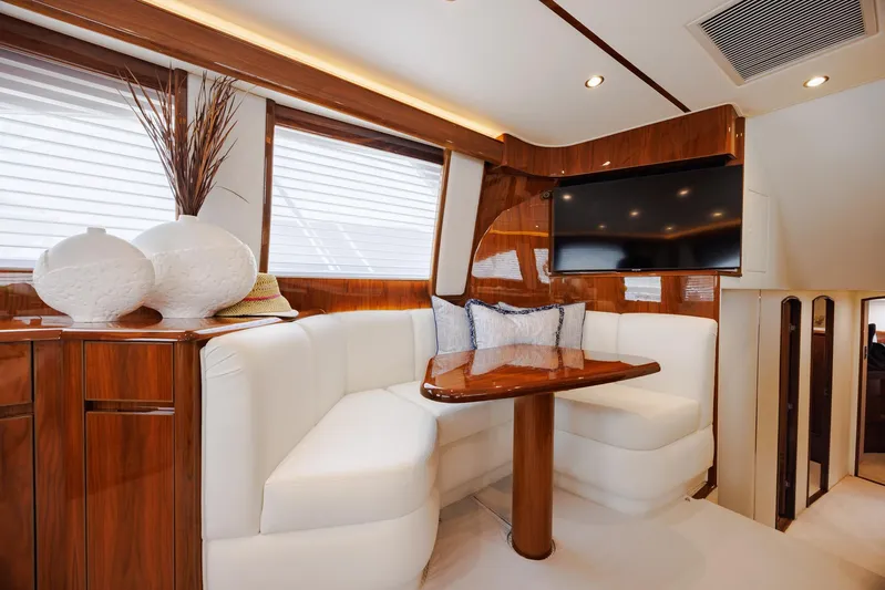 Insomnio Yacht Photos Pics Luxurious interior of 2022 Viking 48 Convertible yacht with elegant seating and modern decor.
