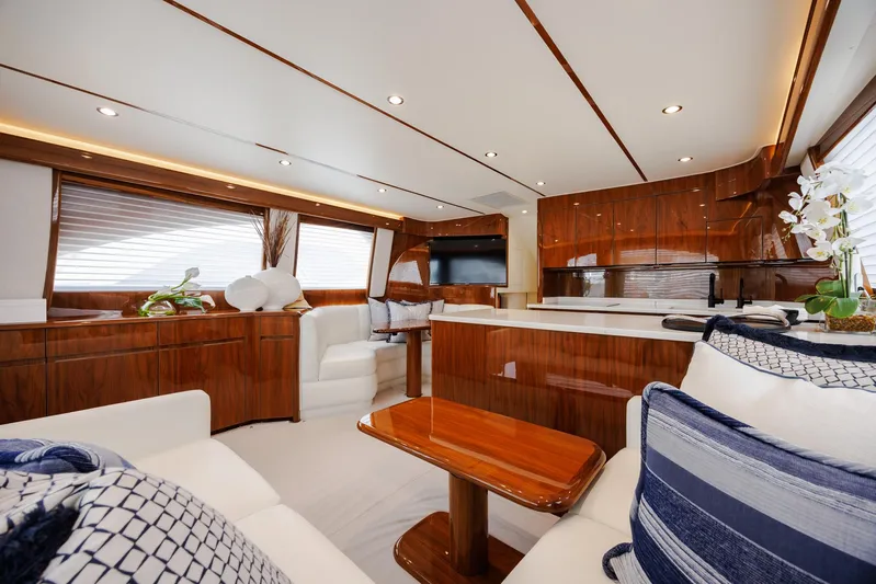 Insomnio Yacht Photos Pics Luxurious interior of 2022 Viking 48 Convertible yacht with elegant wood finishes and modern furnishings.