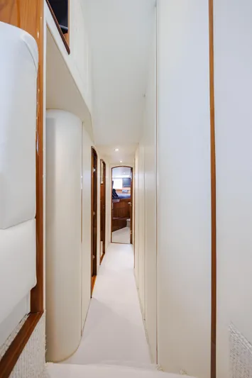 Insomnio Yacht Photos Pics Interior hallway of 2022 Viking 48 Convertible yacht, featuring sleek design and modern finishes.