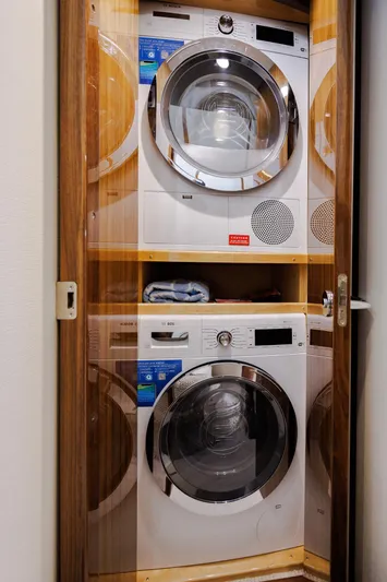 Insomnio Yacht Photos Pics Stacked washer and dryer inside a Viking 48 Convertible yacht, 2022 model.