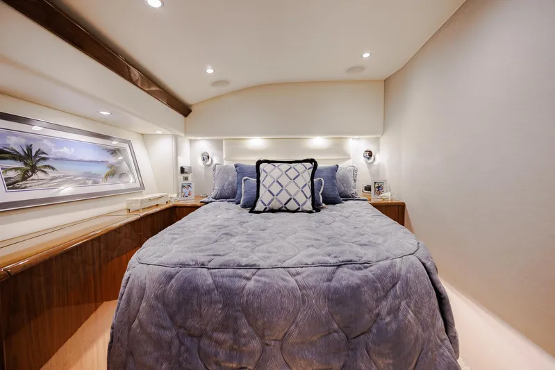 Insomnio Yacht Photos Pics Luxurious bedroom interior of 2022 Viking 48 Convertible yacht with elegant bedding and decor.