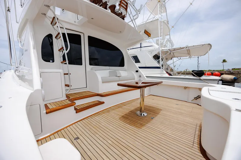 Insomnio Yacht Photos Pics Luxury Viking 48 Convertible yacht deck, 2022 model, featuring elegant wood finishes and modern design.