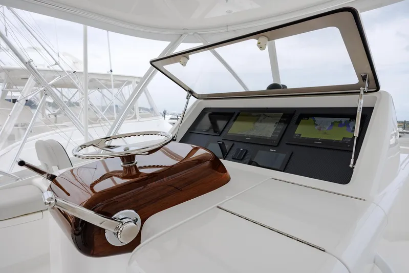 Insomnio Yacht Photos Pics 2022 Viking 48 Convertible yacht helm with advanced navigation displays.