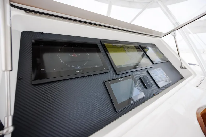 Insomnio Yacht Photos Pics Control panel of 2022 Viking 48 Convertible yacht with navigation screens.