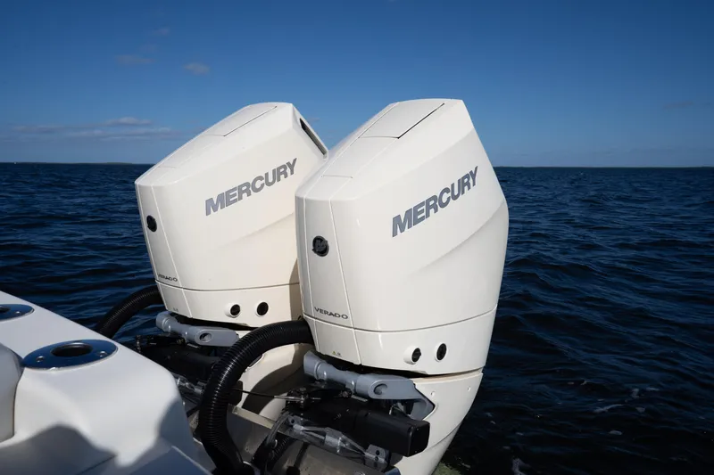 Natural 9 Yacht Photos Pics Twin Mercury Verado engines on a 2024 Scout 330 LXF boat in open water.