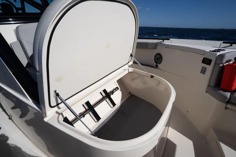 Natural 9 Yacht Photos Pics 2024 Scout 330 LXF boat storage compartment open on deck.