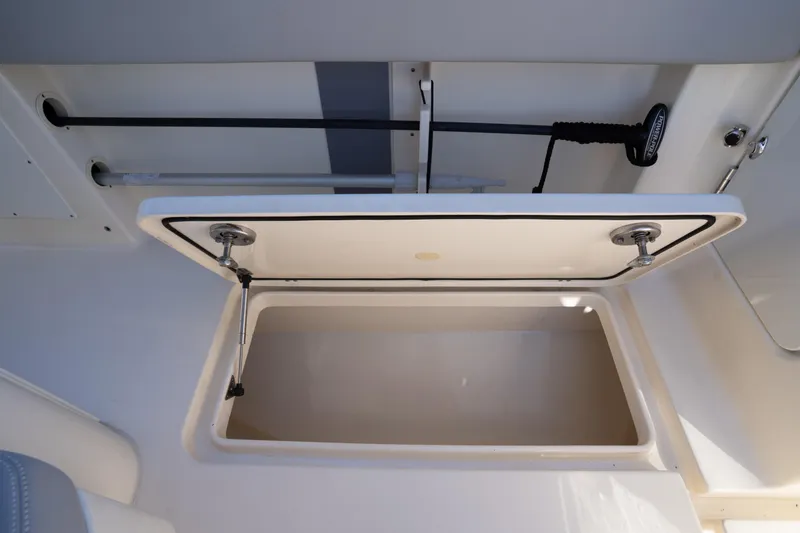 Natural 9 Yacht Photos Pics Open storage compartment on 2024 Scout 330 LXF boat, showcasing interior space.