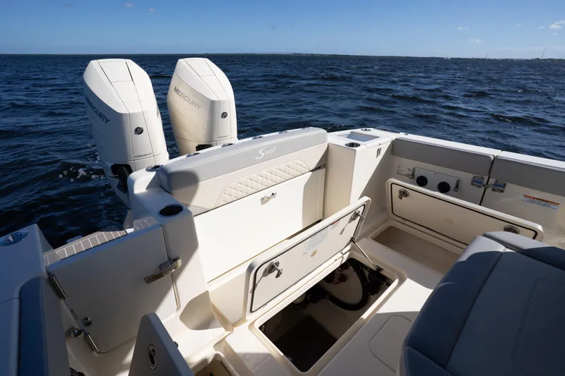 Natural 9 Yacht Photos Pics 2024 Scout 330 LXF boat with dual Mercury engines on open water.