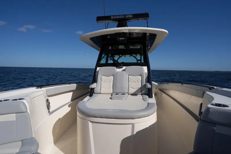 Natural 9 Yacht Photos Pics 2024 Scout 330 LXF boat on open water, featuring sleek seating and modern design.