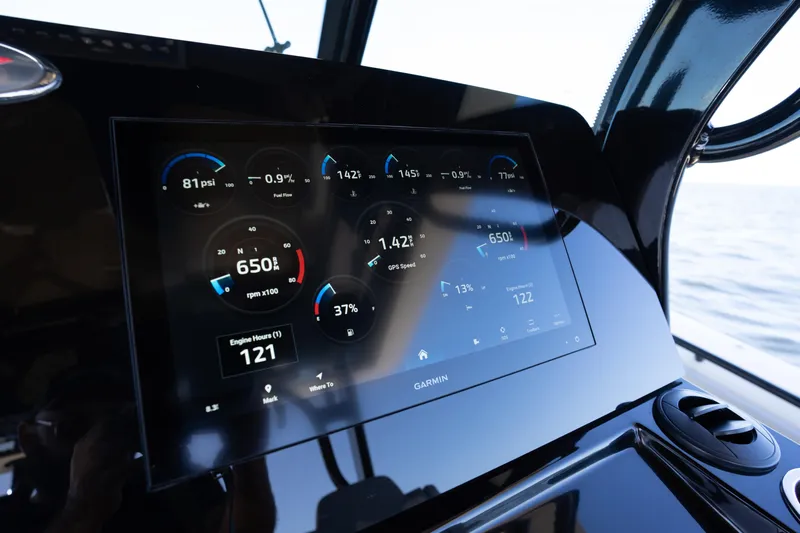 Natural 9 Yacht Photos Pics 2024 Scout 330 LXF dashboard with Garmin display showing engine metrics.