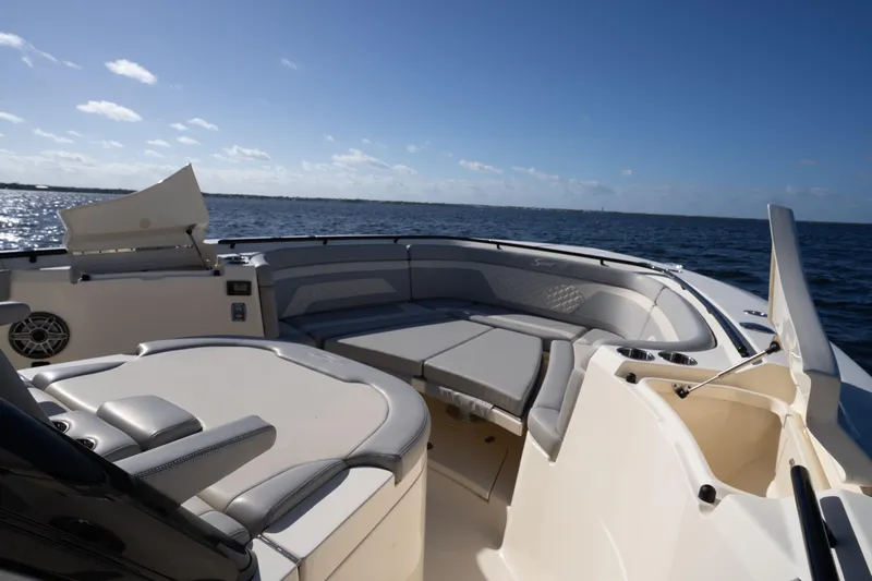 Natural 9 Yacht Photos Pics 2024 Scout 330 LXF boat interior with luxurious seating on open water.