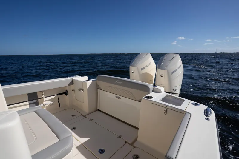 Natural 9 Yacht Photos Pics 2024 Scout 330 LXF boat with dual Mercury engines on open water.