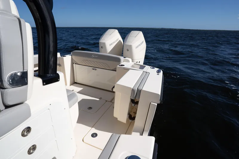 Natural 9 Yacht Photos Pics 2024 Scout 330 LXF boat with dual Mercury engines on open water.
