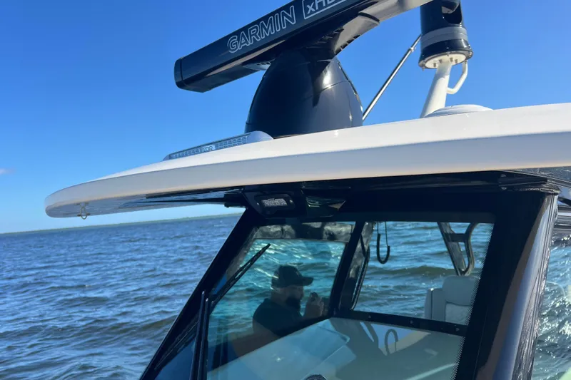 Natural 9 Yacht Photos Pics 2024 Scout 330 LXF boat with Garmin radar on open water.