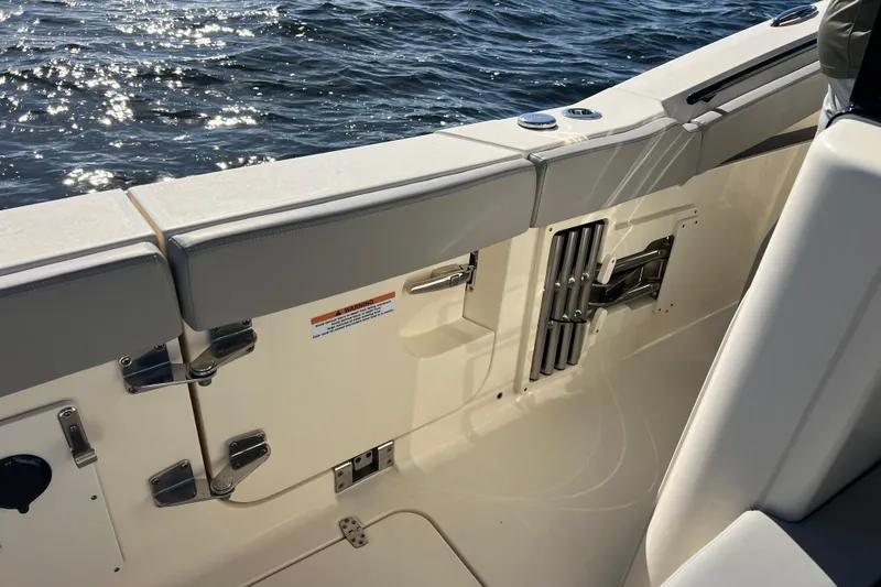 Natural 9 Yacht Photos Pics 2024 Scout 330 LXF boat interior with sleek seating and ocean view.