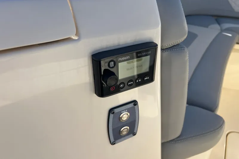Natural 9 Yacht Photos Pics 2024 Scout 330 LXF boat featuring Fusion MS-NRX300 audio system and control panel.
