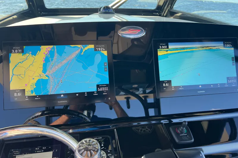 Natural 9 Yacht Photos Pics 2024 Scout 330 LXF boat dashboard with dual Garmin navigation screens.