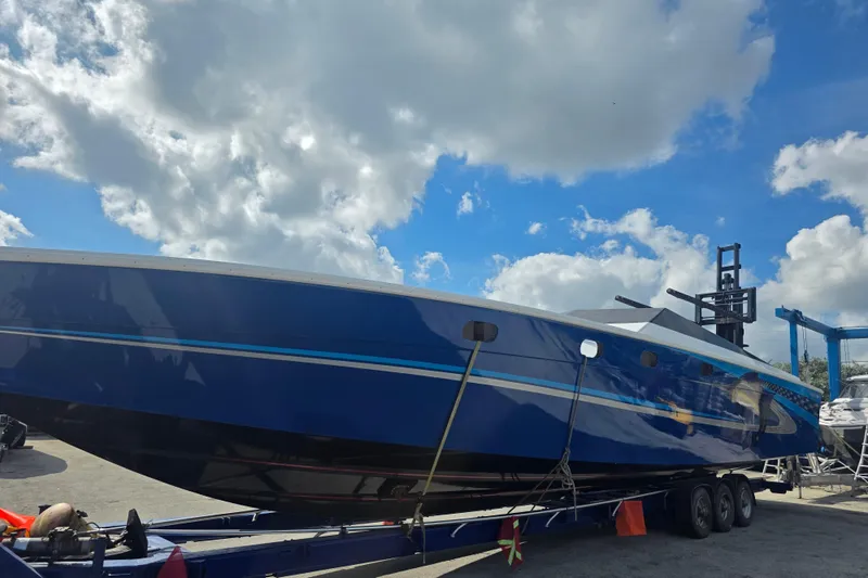  Yacht Photos Pics 2025 Don Smith Custom 55' boat on trailer under a cloudy sky.