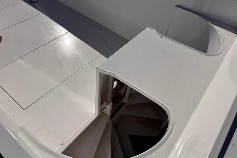  Yacht Photos Pics White deck of 2025 Don Smith Custom 55' boat with storage compartment.