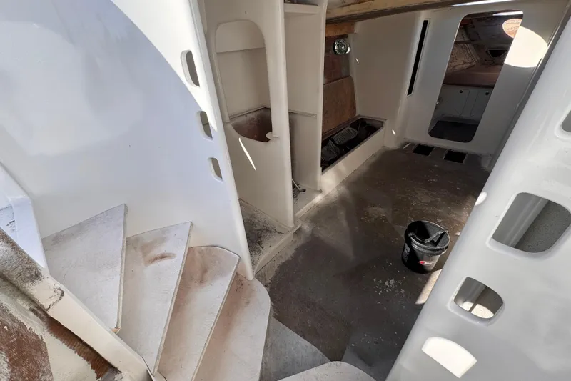  Yacht Photos Pics Interior of 2025 Don Smith Custom 55' yacht under construction, featuring stairs and unfinished surfaces.