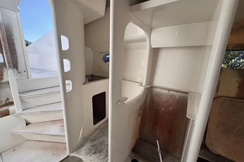  Yacht Photos Pics Interior of 2025 Don Smith Custom 55' boat, featuring white stairway and compartments.