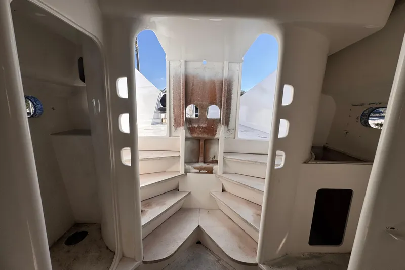  Yacht Photos Pics Interior view of 2025 Don Smith Custom 55' yacht, featuring white staircases and portholes.