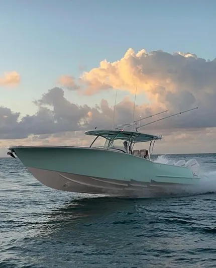  Yacht Photos Pics 2025 Mag Bay 38 CC boat cruising on ocean at sunset.