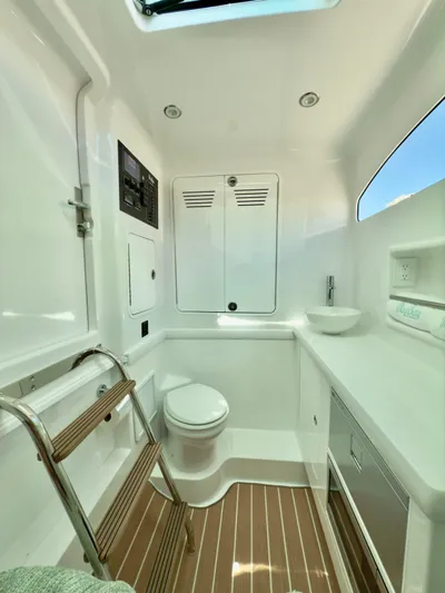  Yacht Photos Pics 2025 Mag Bay 38 CC boat interior with modern bathroom and wooden flooring.