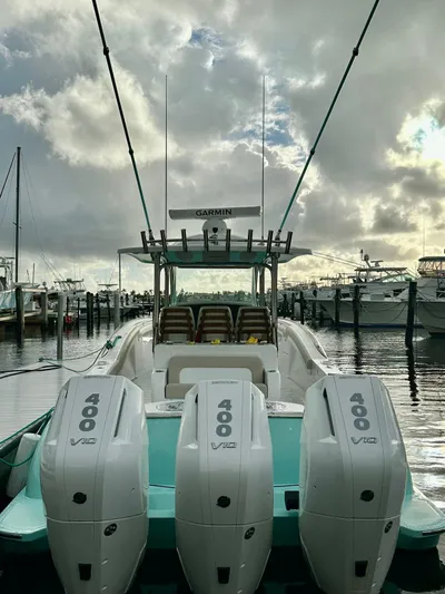  Yacht Photos Pics 2025 Mag Bay 38 CC boat with triple 400 V12 engines docked at marina.