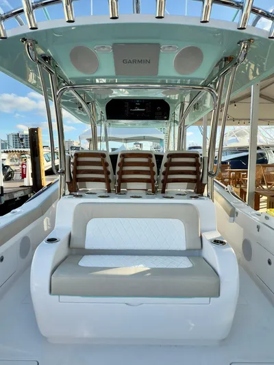  Yacht Photos Pics 2025 Mag Bay 38 CC boat interior with seating and Garmin electronics.