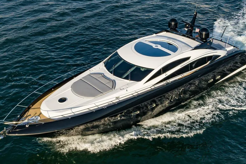 Norma Jean Yacht Photos Pics Luxurious 2007 Sunseeker Predator 82 yacht cruising on open water.