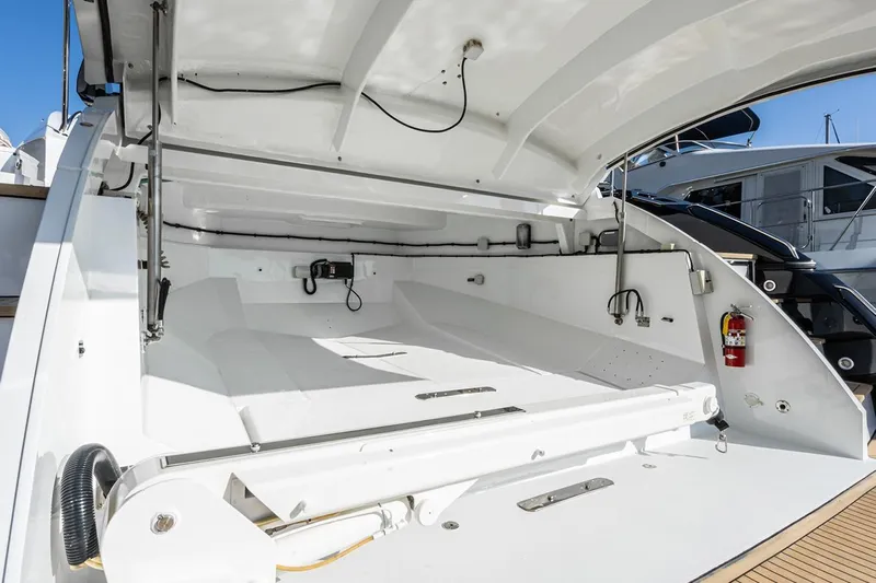 Norma Jean Yacht Photos Pics 2007 Sunseeker Predator 82 yacht's open storage compartment, showcasing sleek design and functionality.