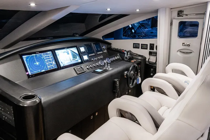 Norma Jean Yacht Photos Pics Luxurious 2007 Sunseeker Predator 82 yacht cockpit with advanced navigation systems and plush seating.