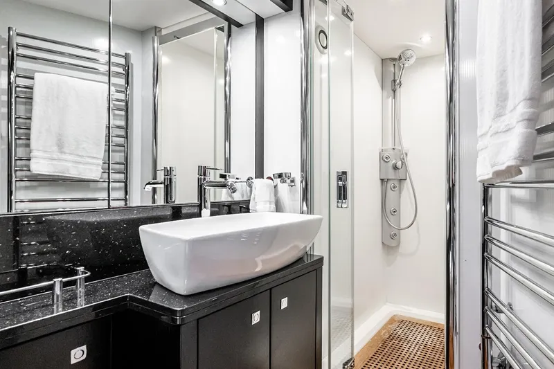 Norma Jean Yacht Photos Pics Luxurious bathroom on 2007 Sunseeker Predator 82 yacht with modern fixtures and shower.