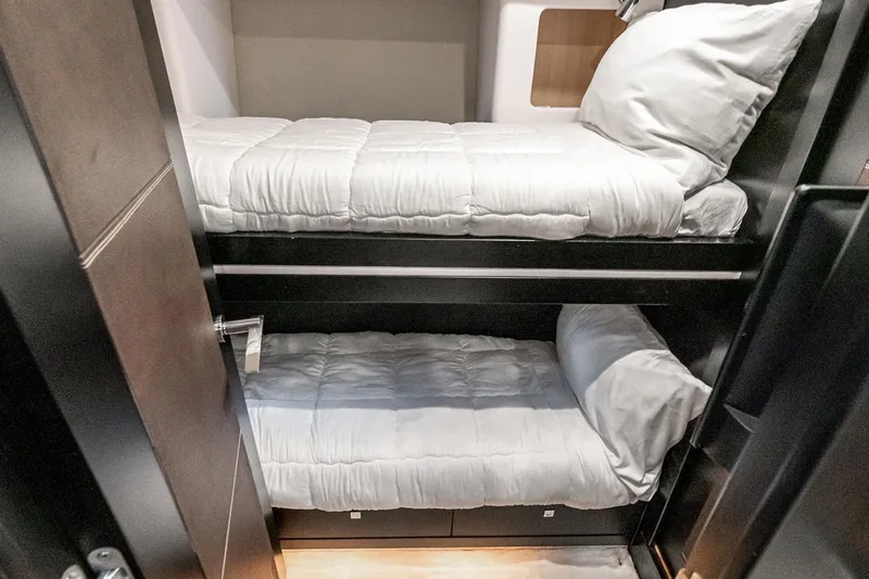 Norma Jean Yacht Photos Pics Bunk beds in 2007 Sunseeker Predator 82 yacht cabin, featuring modern design and comfort.