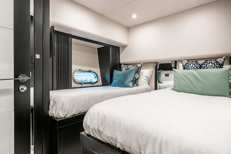 Norma Jean Yacht Photos Pics Luxurious twin cabin interior of 2007 Sunseeker Predator 82 yacht with elegant bedding.